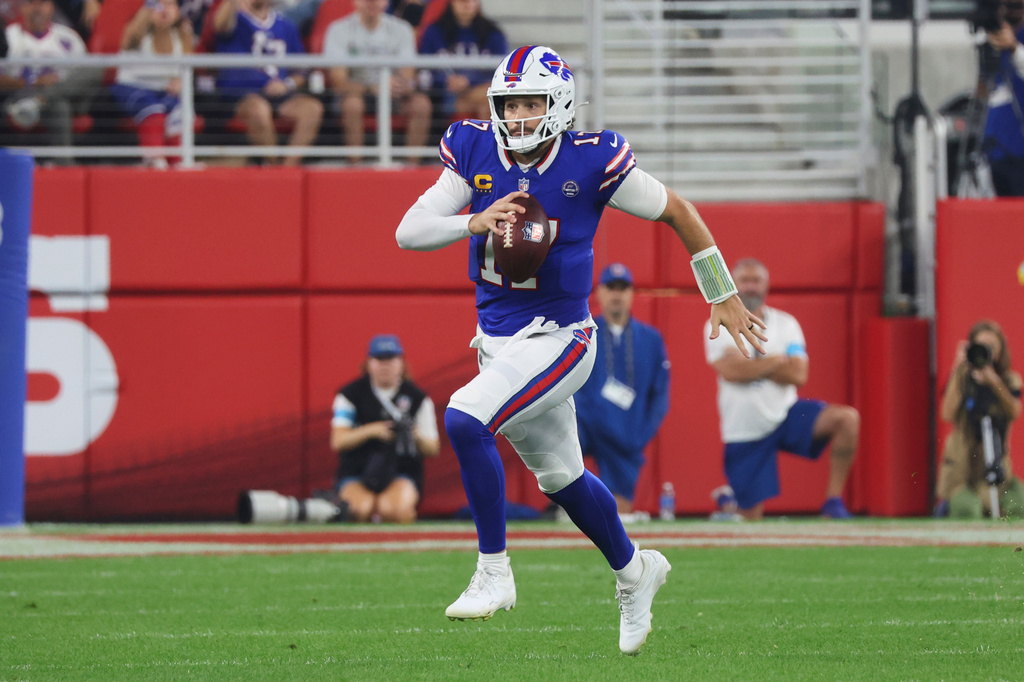 Buffalo Bills quarterback Josh Allen (17) runs the ball against the Detroit Lions during the first half of an NFL football game in Orchard Park, N.Y., Thursday, Sept. 17, 2026. (AP Photo/Jeffrey T. Barnes)