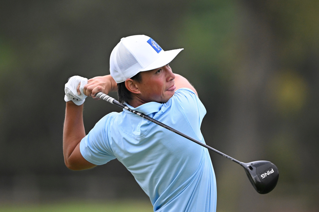 FILE - BYU's Kihei Akina hits his tee shot on the 10th tee during an NCAA golf tournament on Sept. 15, 2026, in Rancho Santa Fe, Calif. (AP Photo/Denis Poroy, File)