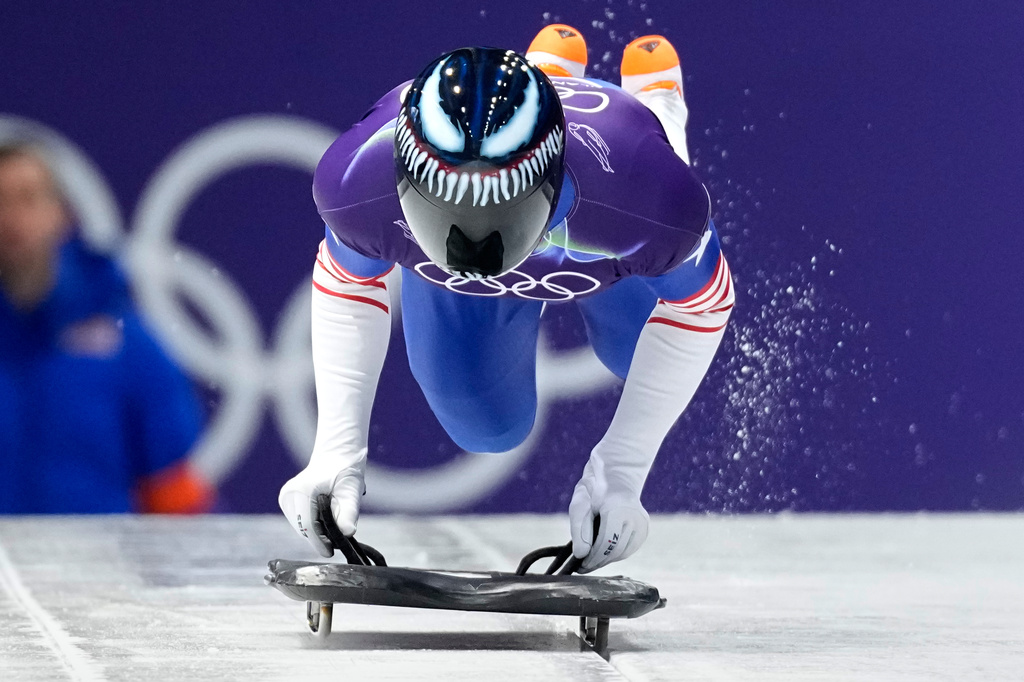 United State's Austin Florian starts for a men's skeleton run at the 2026 Winter Olympics, in Cortina d'Ampezzo, Italy, Thursday, Feb. 12, 2026. (AP Photo/Aijaz Rahi)