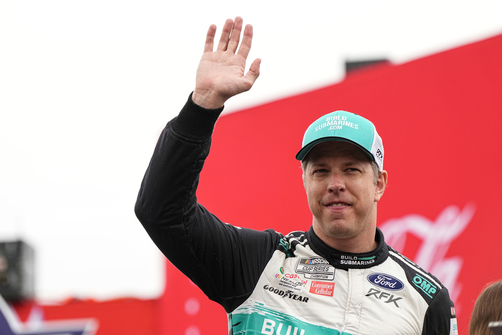 FILE - Brad Keselowski is introduced to fans prior to a NASCAR Cup Series auto race at Charlotte Motor Speedway, May 25, 2025, in Concord, N.C. (AP Photo/Matt Kelley, File)
