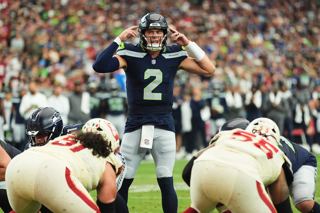 Seattle Seahawks quarterback Drew Lock (2) prepares for a snap against the Arizona Cardinals during the first half of an NFL football game in Glendale, Ariz., Sunday, Sept. 20, 2026. (AP Photo/Ross D. Franklin)