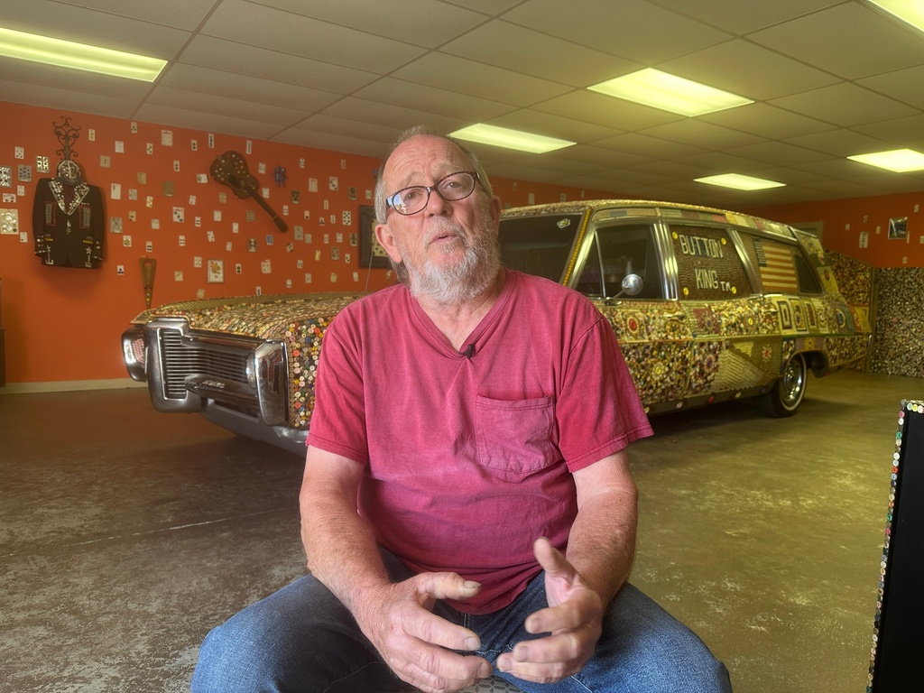 J.D. Stevens talks about his father Dalton Stevens' button museum and all of its folk art in Bishopville, S.C., on Tuesday, Sept. 9, 2025. (AP Photo/Jeffrey Collins)