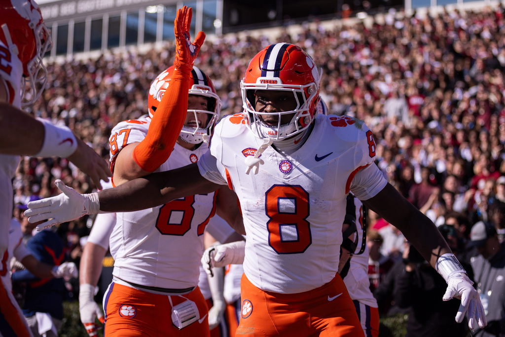 Clemson running back Adam Randall (8) celebrates after a touchdown against the South Carolina during the first half of an NCAA college football game, Saturday, Nov. 29, 2025, in Columbia, S.C. (AP Photo/Scott Kinser)