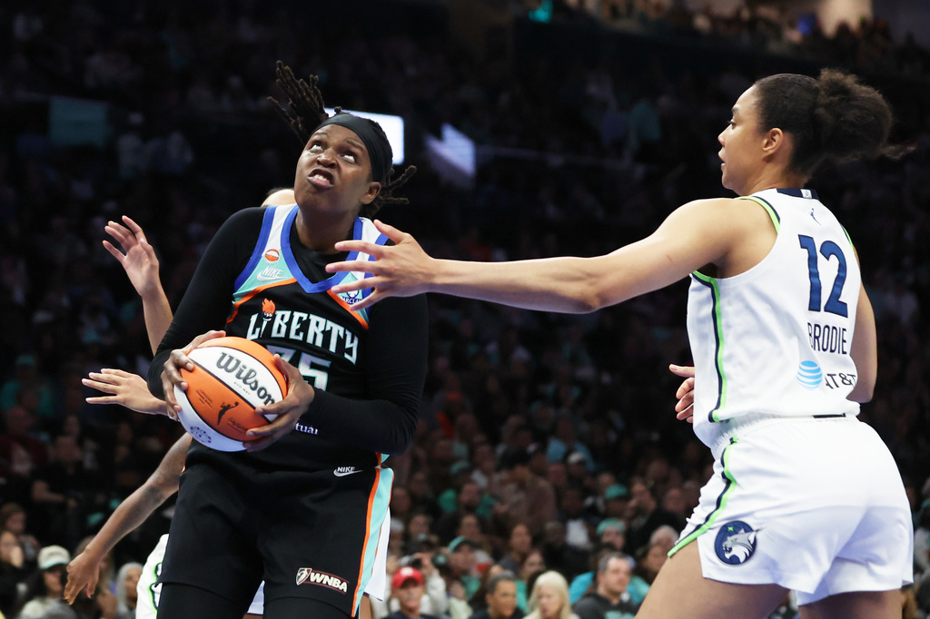New York Liberty center Jonquel Jones goes up to the basket while Minnesota Lynx forward Nia Brodie (12) defends during the second half of Game 2 of a WNBA basketball first-round playoff series, Tuesday, Sept. 29, 2026, in New York. (AP Photo/Heather Khalifa)