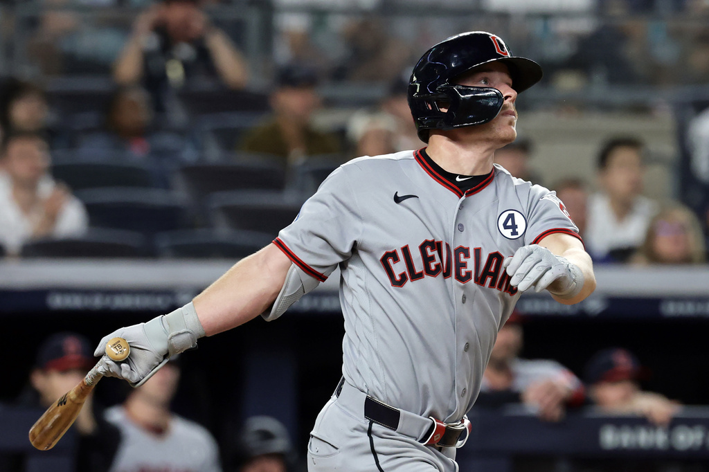 Cleveland Guardians' Travis Bazzana watches his three-run scoring double during the eighth inning of a baseball game against the New York Yankees, Tuesday, June 2, 2026, in New York. (AP Photo/Adam Hunger)