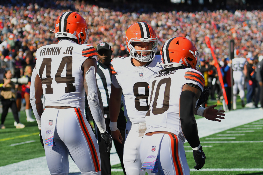 Cleveland Browns quarterback Dillon Gabriel (8) celebrates with tight end Harold Fannin Jr. (44) and running back Quinshon Judkins (10) after Fannin caught a touchdown pass against the New England Patriots in the first half of an NFL football game on Sunday, Oct. 26, 2025, in Foxborough, Mass. (AP Photo/Steven Senne)