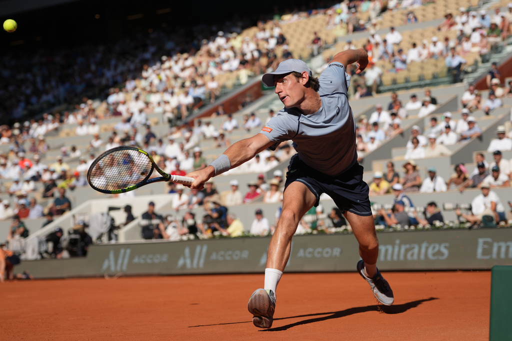 Valentin Royer of France returns to Novak Djokovic of Serbia during their second round men's singles tennis match at the French Open tennis tournament in Paris, Wednesday, May 27, 2026. (AP Photo/Thibault Camus)