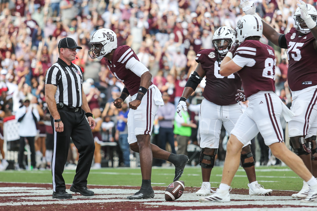 Mississippi State quarterback Kamario Taylor (left) reacts after scoring a touchdown against Georgia during the first half of an NCAA college football game in Starkville, Miss., Saturday, Nov. 8, 2025. (AP Photo/James Pugh)