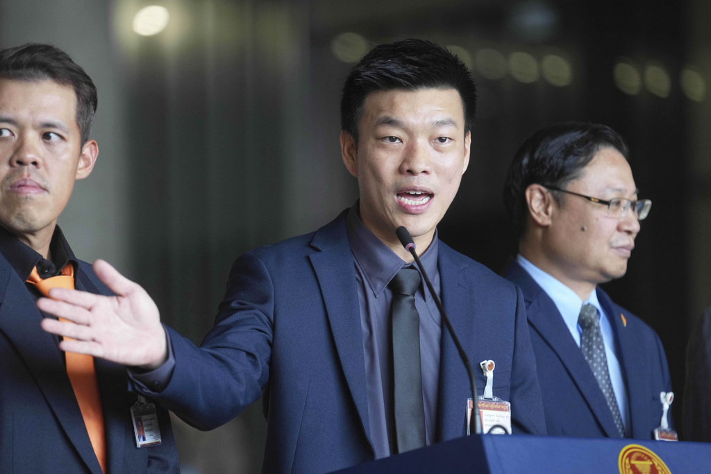 Leader of People's Party, Natthaphong Ruengpanyawut talks to reporters during a press conference at Parliament in Bangkok, Thailand, Wednesday, Sept. 3, 2025. (AP Photo/Sakchai Lalit)