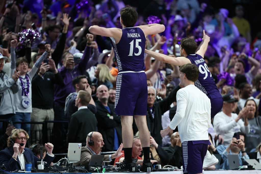 High Point forward Braden Hausen (15) celebrates with guard Chase Johnston (99) after the first round of the NCAA college basketball tournament Thursday, March 19, 2026, in Portland, Ore. (AP Photo/Amanda Loman)