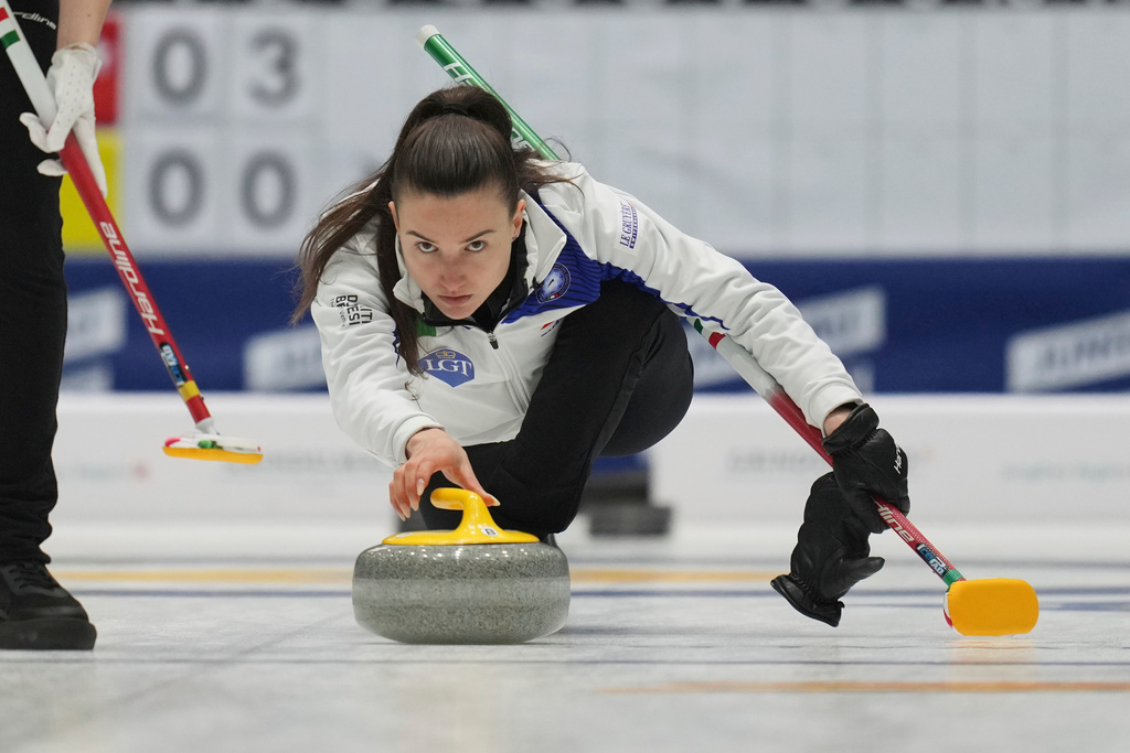 FILE - Italy's skip Stefania Constantini releases the stone during the match against Canada at the World Women's Curling Championship in Uijeongbu, South Korea, Friday, March 21, 2025. (AP Photo/Lee Jin-man, File)
