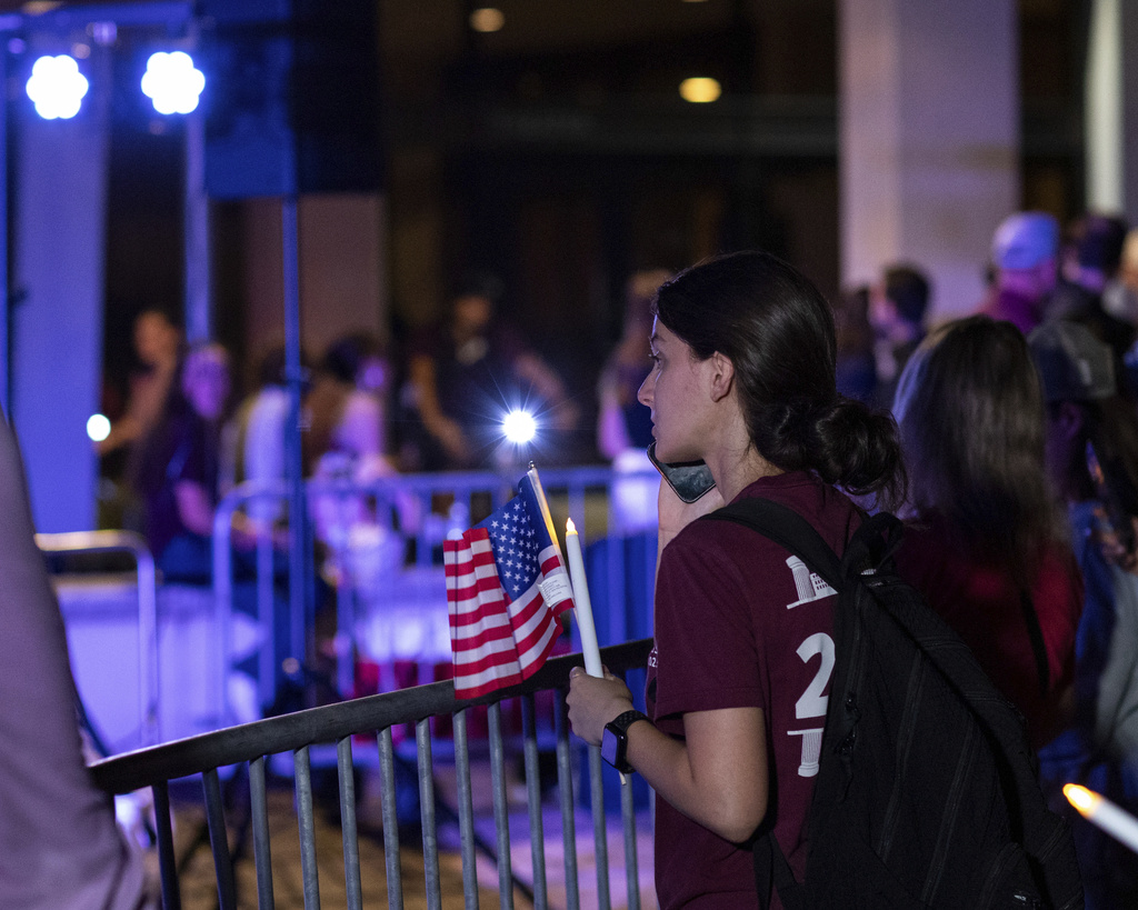 People gather prior to a vigil for Charlie Kirk at Rudder Plaza on the Texas A&M Campus in College Station, Texas on Thursday, Sept. 11, 2025. (Meredith Seaver/College Station Eagle via AP)