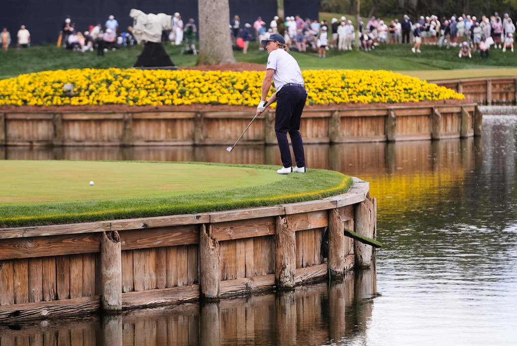 Austin Smotherman putts on the 17th green during the first round of The Players Championship golf tournament Thursday, March 12, 2026, in Ponte Bedra Beach, Fla. (AP Photo/Gerald Herbert)