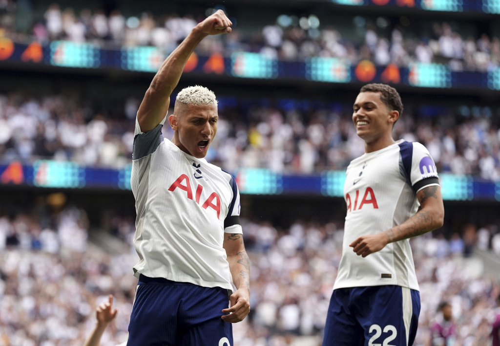 Tottenham Hotspur's Richarlison, left, celebrates scoring the opening goal during the the English Premier League soccer match between Tottenham Hotspur and Burnley at the Tottenham Hotspur Stadium in London, Saturday, Aug. 16, 2025. (Adam Davy/PA via AP)
