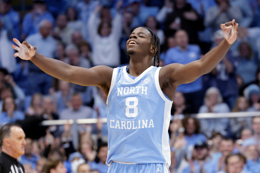 FILE - North Carolina forward Caleb Wilson (8) celebrates after scoring against Florida State during the second half of an NCAA college basketball game, Dec. 30, 2025, in Chapel Hill, N.C. (AP Photo/Chris Seward, File)