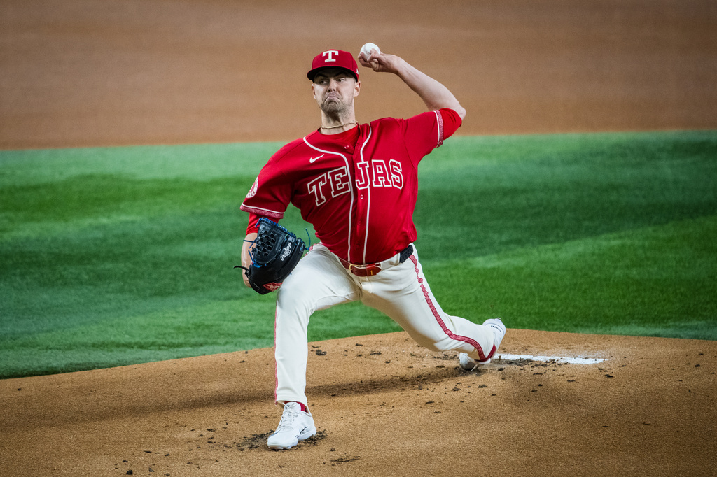 Texas Rangers' MacKenzie Gore (1) pitches during the first inning of a baseball game against the Mariners, Friday, July 24, 2026, Arlington, Texas. (AP Photo/Jessica Tobias)