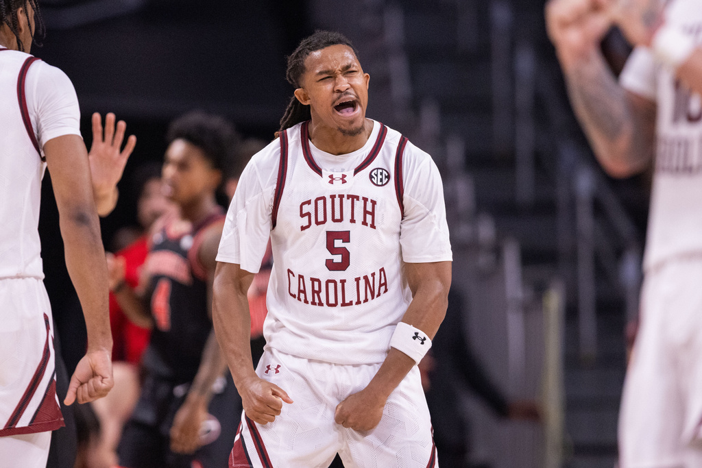 South Carolina guard Meechie Johnson (5) celebrates after scoring against the Georgia in the first half of an NCAA college basketball game Saturday, Jan. 10, 2026, in Columbia, S.C. (AP Photo/Scott Kinser)