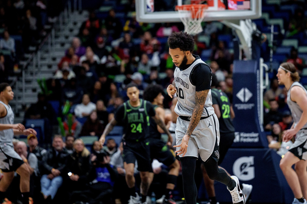 San Antonio Spurs forward Julian Champagnie reacts after a three-point basket against the New Orleans Pelicans during the first half of an NBA basketball game in New Orleans, Monday, Dec. 8, 2025. (AP Photo/Matthew Hinton)