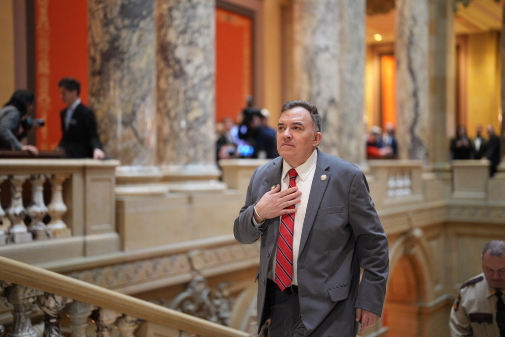 FILE - State Sen. John Hoffman climbs the stairs at the Minnesota State Capitol in St. Paul, Minn., Feb. 17, 2026, the first day of the 2026 legislative session. (Alex Kormann/Star Tribune via AP, File)