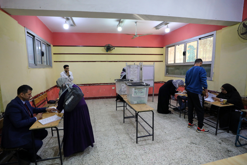 Egyptians cast their ballots during the second phase of parliamentary elections in Cairo, Egypt, Monday, Nov. 24, 2025. (AP Photo/Khaled Elfiqi)