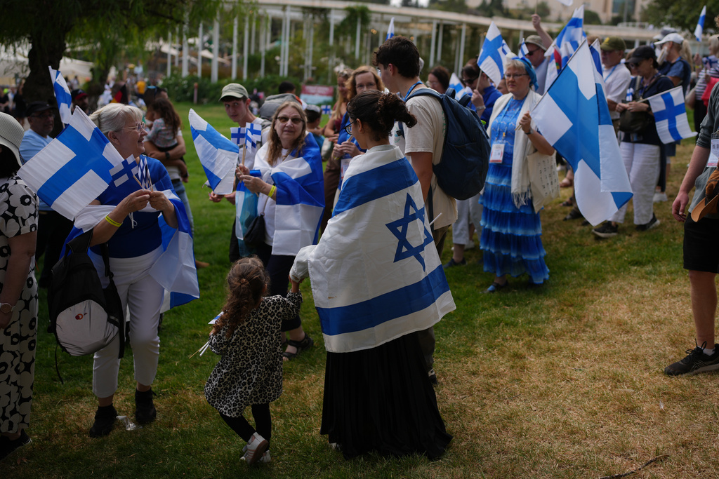 Evangelical Christians from around the world gather for a traditional march in support of Israel during the Jewish holiday of Sukkot, in Jerusalem, Thursday, Oct. 9, 2025, following the announcement that Israel and Hamas have agreed to the first phase of a peace plan to pause the fighting. (AP Photo/Ohad Zwigenberg)