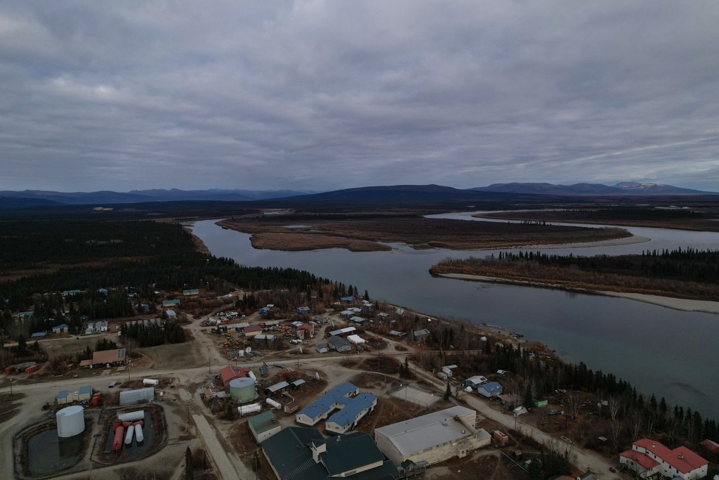 Ambler, Alaska, front, is visible on Sunday, Sept. 28, 2025, with the Gates of the Arctic National Park in the background. The Ambler Road, once constructed, would pass through the park. (AP Photo/Annika Hammerschlag)