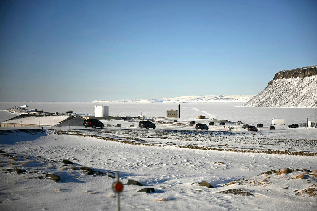 FILE - The motorcade of Vice President JD Vance travels through Pituffik Space Base during a tour, March 28, 2025, in Greenland. (Jim Watson/Pool via AP, File)