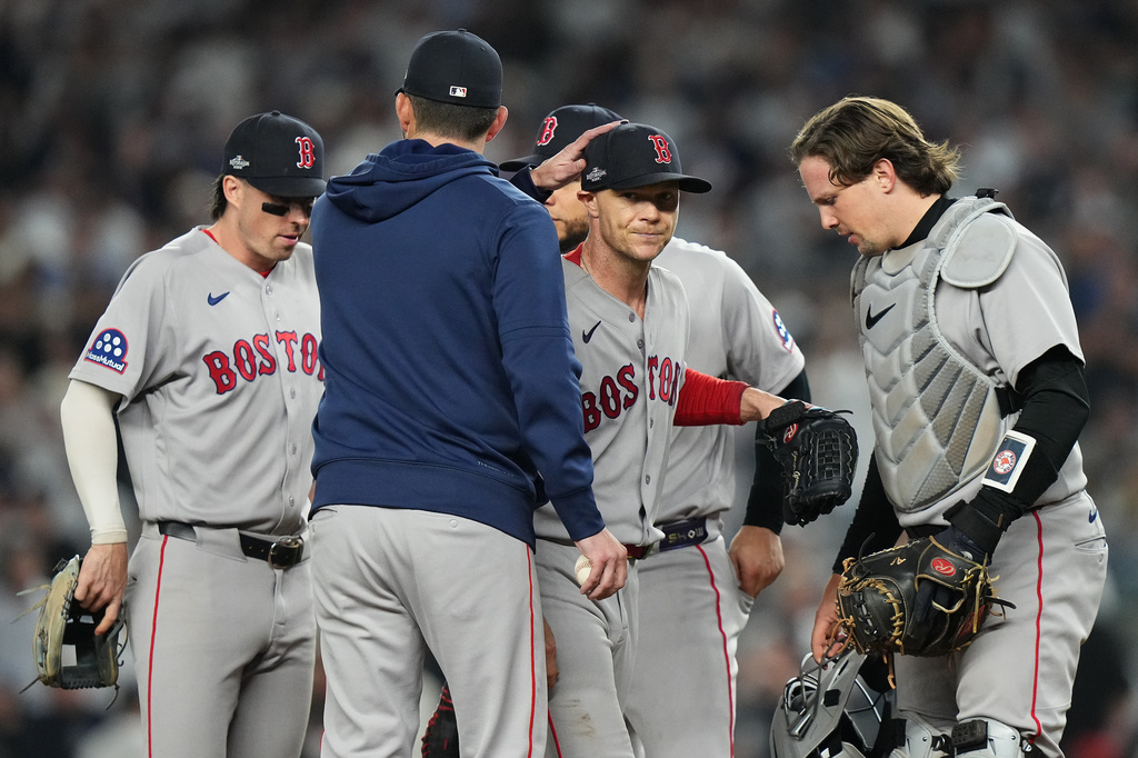 Boston Red Sox starting pitcher Sonny Gray, center facing, is pulled from the game against the New York Yankees during the fifth inning in Game 2 of baseball's American League Wild Card Series, Wednesday, Sept. 30, 2026, in New York. (AP Photo/Frank Franklin II)