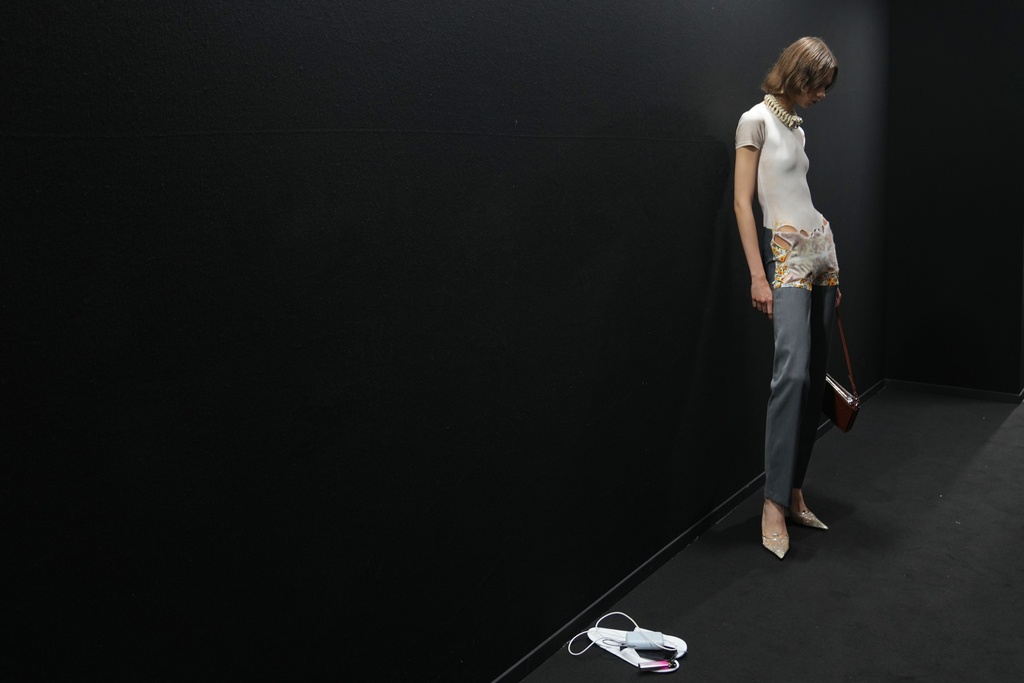 A model wears a creation part of the Diesel's Spring Summer 2026 collection in the backstage ahead of the collection's show, in Milan, Italy, Tuesday, Sept. 23, 2025. (AP Photo/Antonio Calanni)