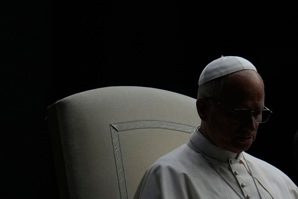 Pope Leo XIV presides over a Rosary vigil for peace in St. Peter's Square on the 63rd anniversary of the start of the Second Vatican Council, at the Vatican, Saturday, Oct. 12, 2025. (AP Photo/Gregorio Borgia)