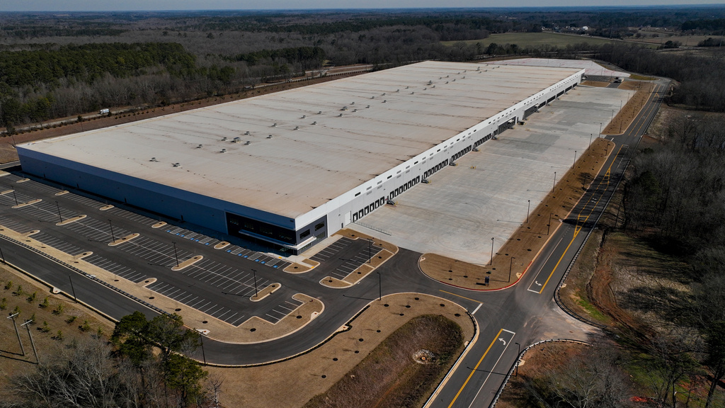 FILE - A newly built warehouse is seen on Friday, Feb. 6, 2026, in Social Circle, Ga., where officials are concerned about U.S. Immigrations and Customs Enforcement's plans connected to a $45-billion expansion of immigrant detention centers. (AP Photo/Mike Stewart, file)