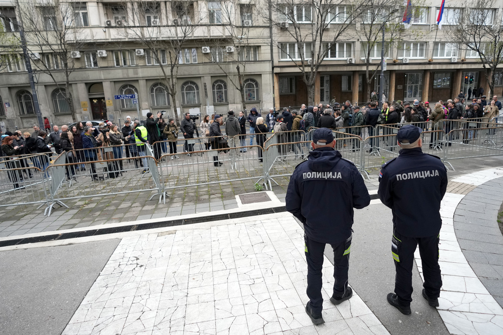 Serbian journalists block the traffic outside the offices of Serbia's President Aleksandar Vucic in Belgrade, Serbia, Wednesday, April 1, 2026, in protest of mounting attacks and pressure on the media. (AP Photo/Darko Vojinovic)