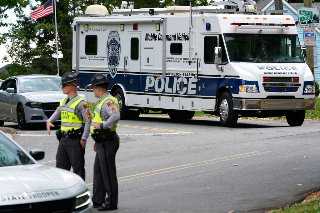 A police mobile command vehicle leaves the the scene of a shooting at Leinbach Park on Monday, April 20, 2026, in Winston-Salem, N.C. (AP Photo/Erik Verduzco)
