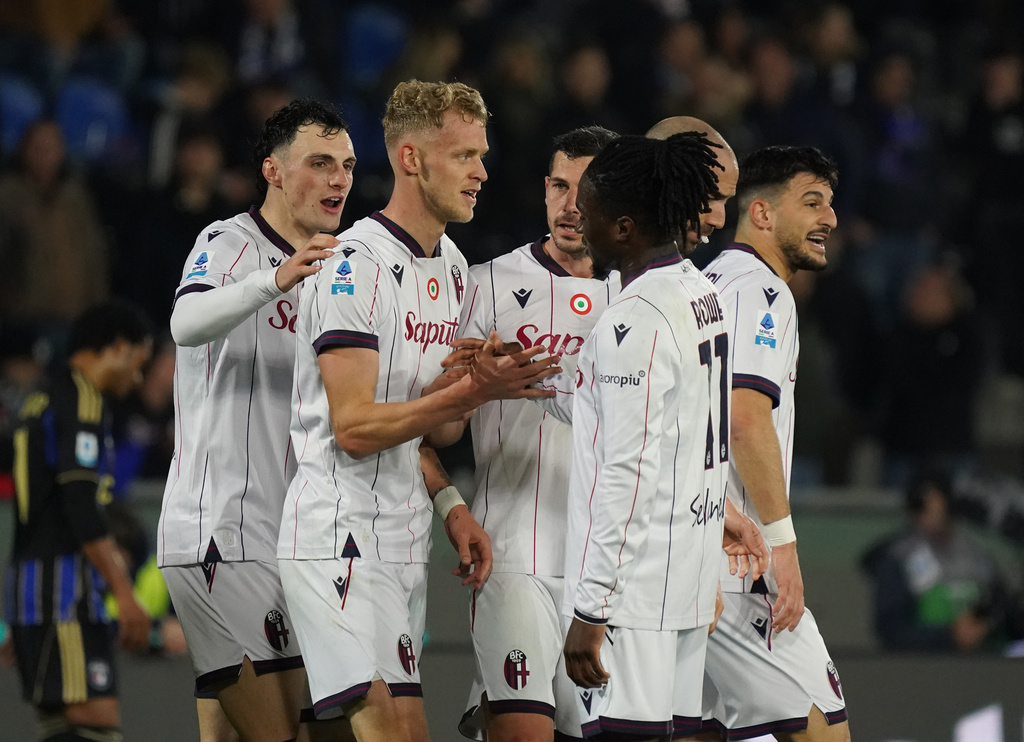 Bologna's Jens Odgard, 2nd left, celebrates with teammates after scoring, during the Serie A soccer match between Pisa and Bologna, in Pisa, Italy, Monday, March 2, 2026. (Alessandro La Rocca/LaPresse via AP)