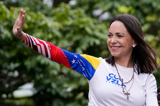 FILE - Opposition leader Maria Corina Machado waves from atop a truck during the closing election campaign rally for presidential candidate Edmundo Gonzalez in Caracas, Venezuela, Thursday, July 25, 2024. (AP Photo/Matias Delacroix, File) FILE - Opposition leader Maria Corina Machado waves from atop a truck during the closing election campaign rally for presidential candidate Edmundo Gonzalez in Caracas, Venezuela, Thursday, July 25, 2024. (AP Photo/Matias Delacroix, File)