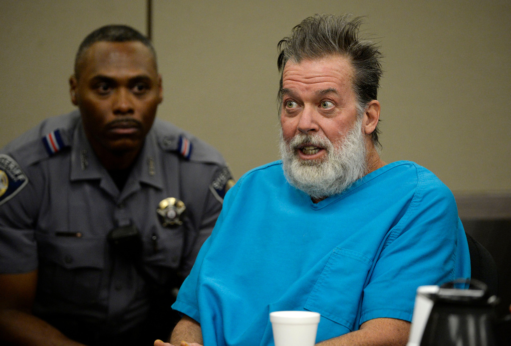 FILE - Robert Dear talks to Judge Gilbert Martinez during a court appearance in Colorado Springs, Colo., on Dec. 9, 2015. (Andy Cross/The Denver Post via AP, Pool, File)