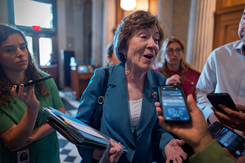 FILE -Sen. Susan Collins, R-Maine, responds to reporters at the Capitol in Washington, July 14, 2026. (AP Photo/J. Scott Applewhite, File)