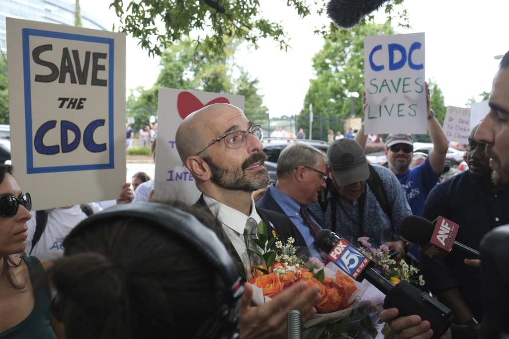 Dr. Demetre Daskalakis talks to reporters as workers and supporters rally for departing scientific leaders at the Centers for Disease Control and Prevention outside the CDC headquarters, Thursday, Aug. 28, 2025, in Atlanta. (AP Photo/Ben Gray)