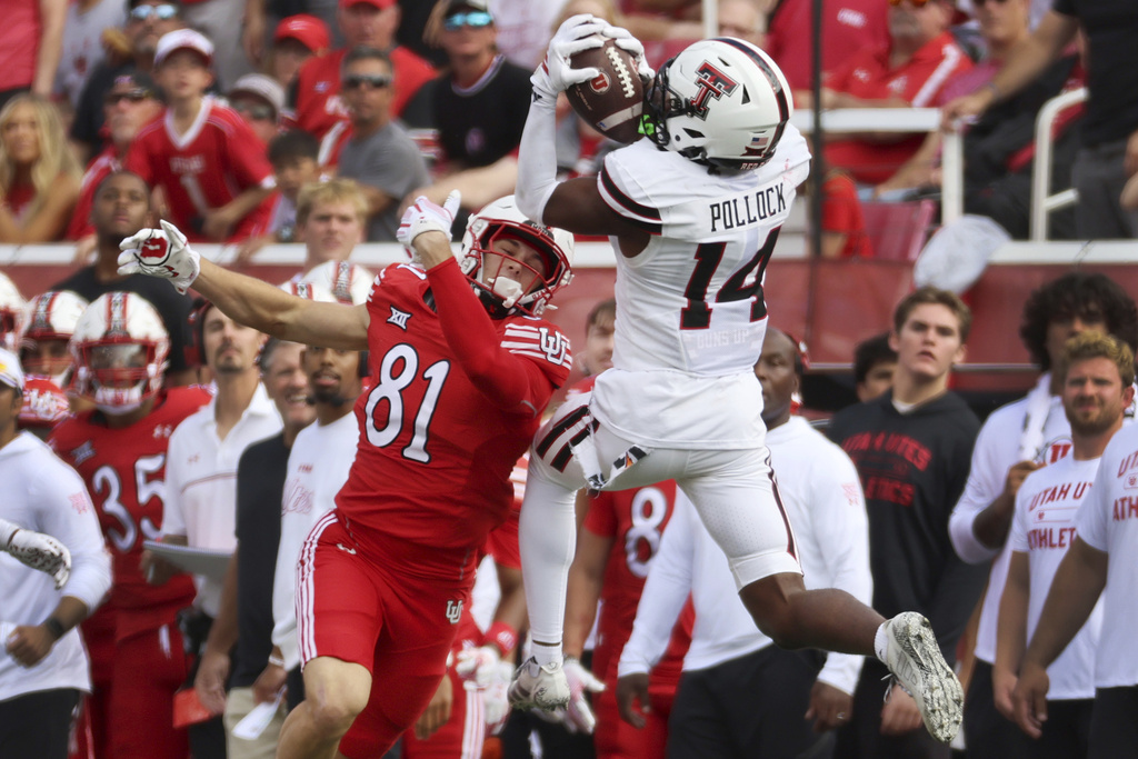 Texas Tech defensive back Brice Pollock intercepts a pass intended for Utah tight end JJ Buchanan during the first half of an NCAA college football game Saturday, Sept. 20, 2025, in Salt Lake City, Utah. (AP Photo/Jeffrey D. Allred)
