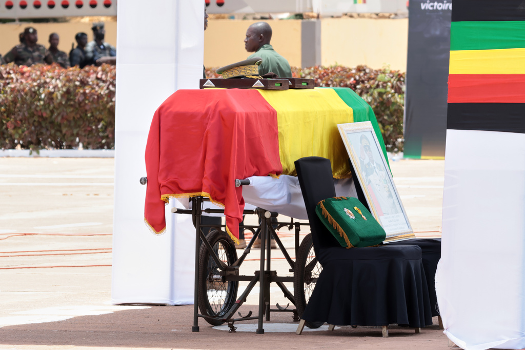 The flag draped casket that contains the remains of Mali's former defense minister Sadio Camara during a funeral ceremony at the Military Engineering Parade Ground in Bamako, Mali, Thursday, April 30, 2026. (AP Photo/Boubacary Bocoum)