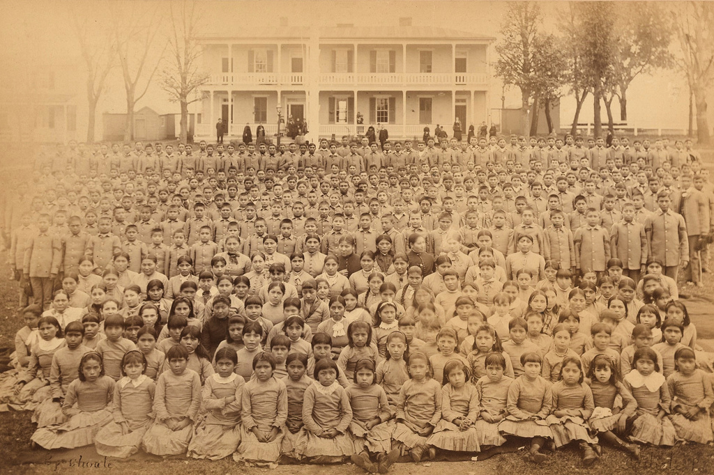 This photo provided by the Carlisle Indian School Digital Resource Center shows the Carlisle Indian Industrial School student body in front of the superintendent's house in Carlisle, Pa., circa 1885. (John N. Choate/Carlisle Indian School Digital Resource Center via AP)
