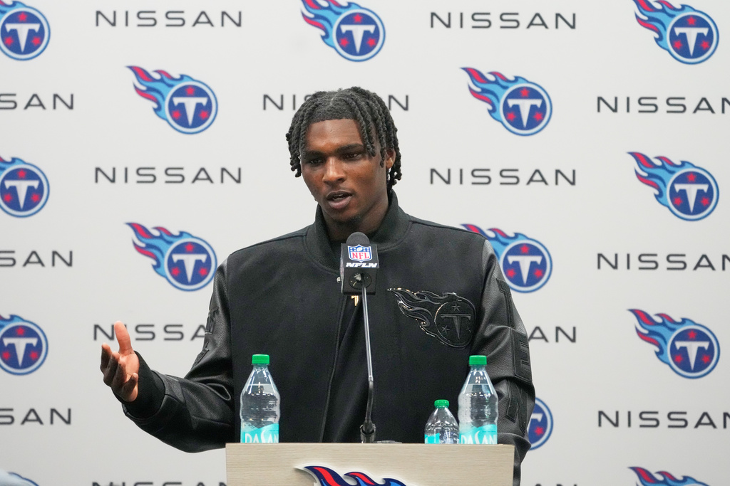 Tennessee Titans quarterback Cam Ward talks during a news conference after an NFL football game between the Tennessee Titans and the Jacksonville Jaguars Sunday, Nov. 30, 2025, in Nashville, Tenn. (AP Photo/George Walker IV)