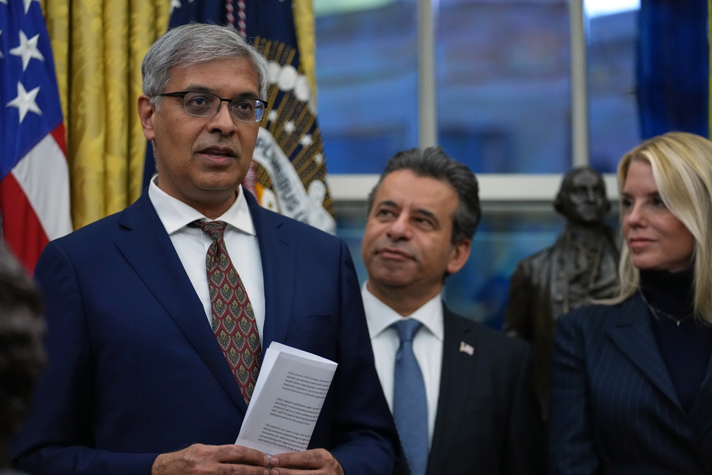 Dr. Jay Bhattacharya, director of the National Institutes of Health, speaks at an event on addiction recovery in the Oval Office of the White House, Thursday, Jan. 29, 2026, in Washington, as Dr. Marty Makary, commissioner of the Food and Drug Administration, and Attorney General Pam Bondi listen. (AP Photo/Allison Robbert)