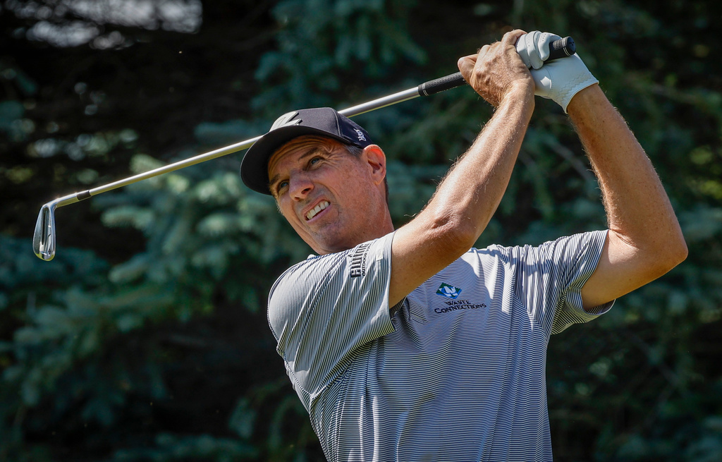 New Zealand's Stephen Alker hits a tee shot on the fifth hole during the PGA Tour Champions golf event in Calgary, Alberta, Sunday, Aug. 23, 2026. (Jeff McIntosh/The Canadian Press via AP)