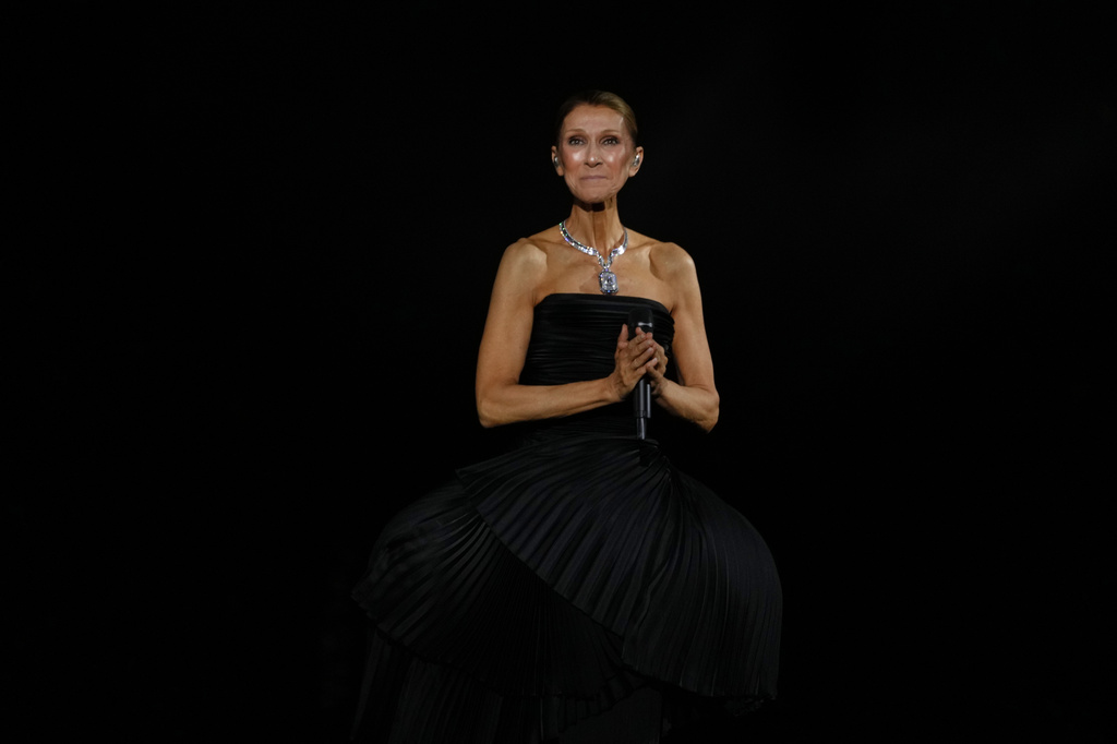 Singer Celine Dion performs during the opening concert of her "Celine Dion Paris 2026" residency at the Plenitude Arena in Nanterre, France, outside Paris, Saturday, Sept. 12, 2026. (AP Photo/Aurelien Morissard)