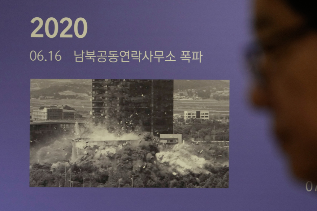 A photo showing the demolition of an inter-Korean liaison office building in Kaesong, North Korea, is displayed at the Unification Observation Post in Paju, South Korea, near the border with North Korea, Wednesday, Sept. 16, 2026. The sign reads ''The demolition of an inter-Korean liaison office building.'' (AP Photo/Ahn Young-joon)