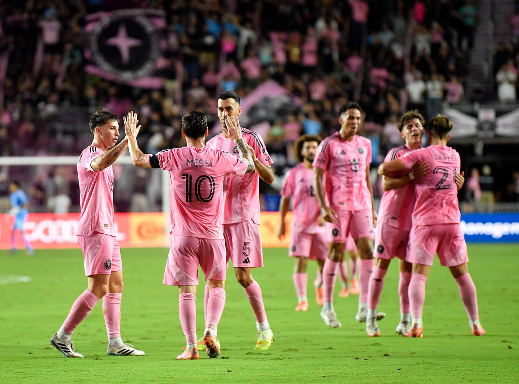 Inter Miami forward Lionel Messi (10) celebrates with teammates after scoring during the first half of Game 3 in the first round of MLS soccer's Western Conference playoffs against Nashville SC in Fort Lauderdale, Fla., Nov. 8, 2025. (AP Photo/Michael Laughlin)