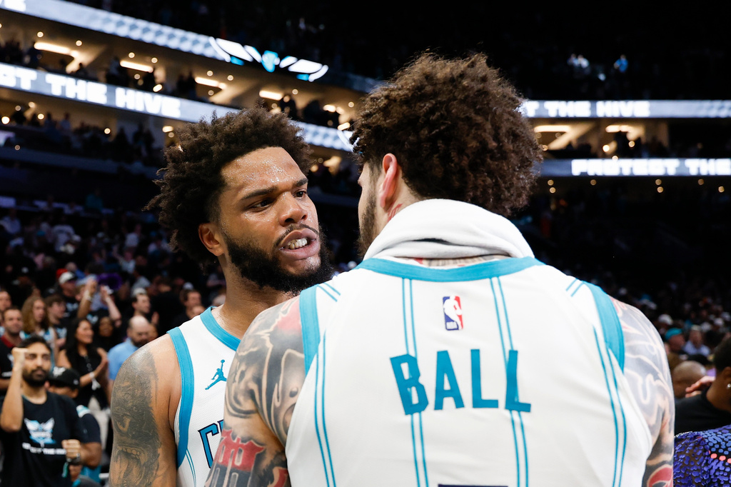 Charlotte Hornets forward Miles Bridges, left, celebrates with guard LaMelo Ball after an NBA play-in tournament basketball game against the Miami Heat in Charlotte, N.C., Tuesday, April 14, 2026. (AP Photo/Nell Redmond)