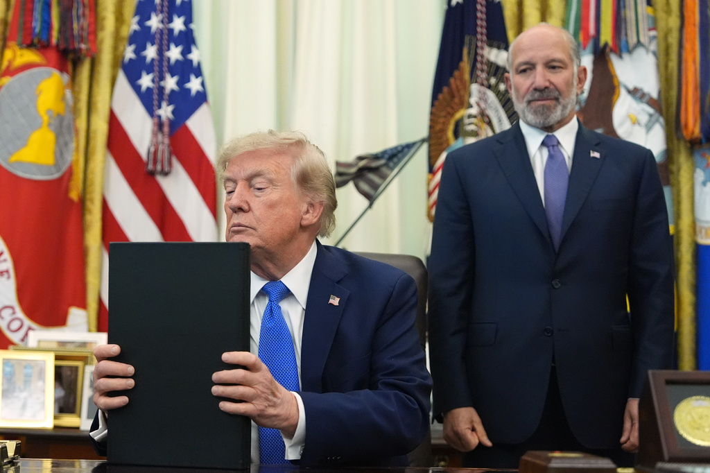 President Donald Trump listens before signing executive orders in the Oval Office of the White House, Thursday, Aug. 6, 2026, in Washington, as Commerce Secretary Howard Lutnick watches. (AP Photo/Alex Brandon)