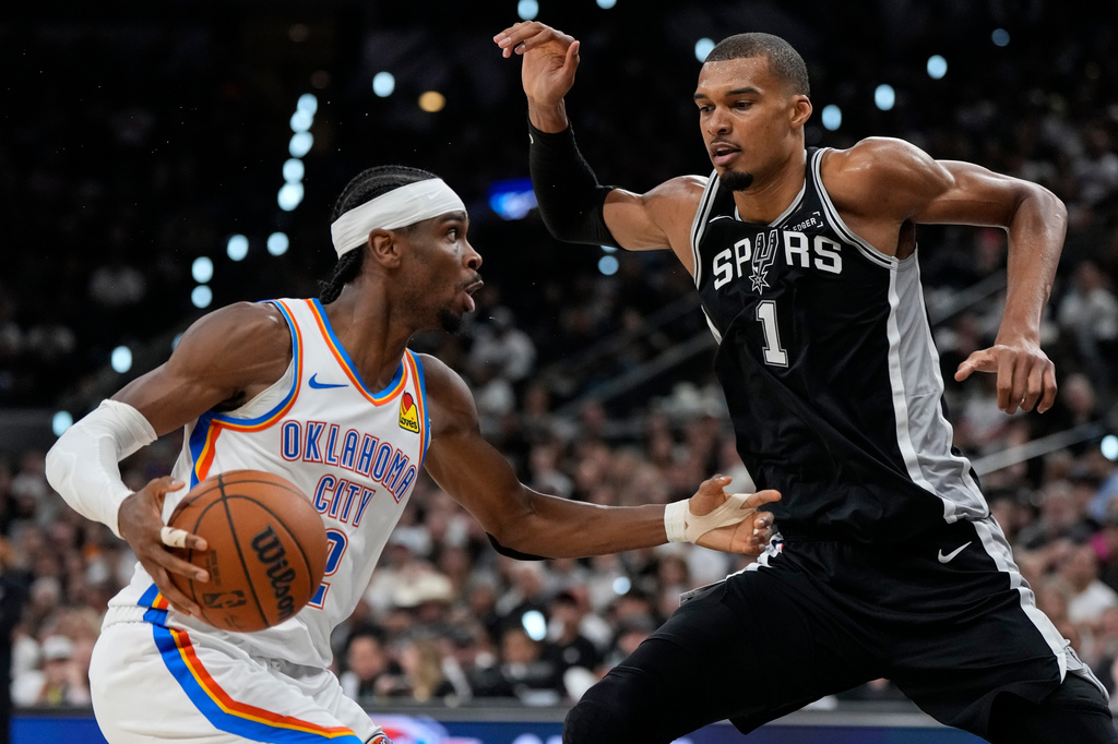 Oklahoma City Thunder guard Shai Gilgeous-Alexander (2) drives against San Antonio Spurs forward Victor Wembanyama (1) in the second half of Game 6 in the Western Conference finals NBA basketball playoffs series, Thursday, May 28, 2026, in San Antonio. (AP Photo/David J. Phillip)